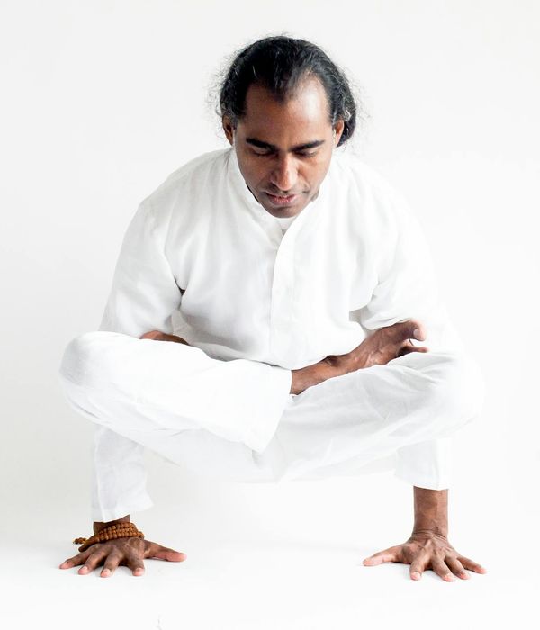 Man in a state of calm concentration during a strength exercise.